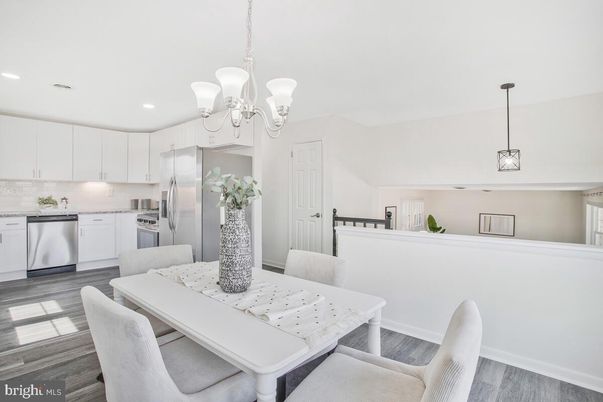 Chandelier, Dining room, Interior, Kitchen, Pendant Lights, Recessed Lighting, Stainless Steel Appliances, Wood Texture Flooring