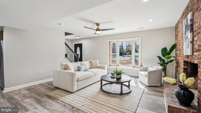 Fireplace, Interior, Living room, Recessed Lighting, Stone Walls, Wood Texture Flooring