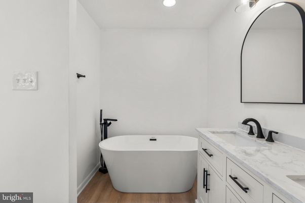 Bathroom, Dual Sink Vanities, Free Standing Baths, Interior, Recessed Lighting, Wood Texture Flooring