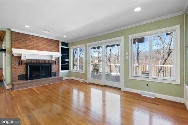 Empty room, Fireplace, Interior, Recessed Lighting, Stone Walls, Wood Texture Flooring