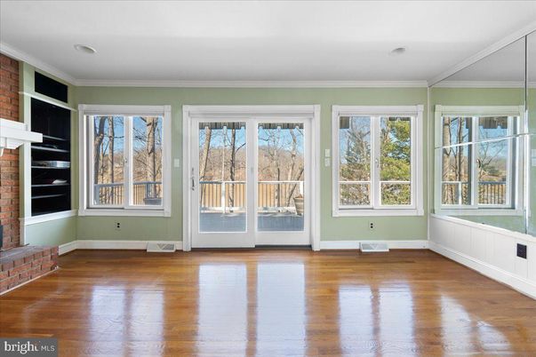 Empty room, Fireplace, Interior, Recessed Lighting, Stone Walls, Wood Texture Flooring
