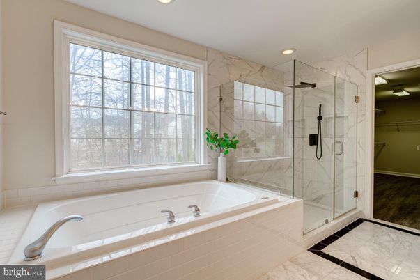 Bathroom, Glass Shower, Interior, Marble, Marble Walls, Recessed Lighting, Wood Texture Flooring