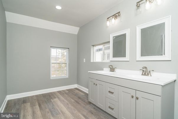 Bathroom, Dual Sink Vanities, Interior, Recessed Lighting, Wood Texture Flooring