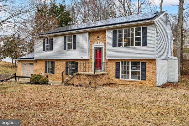 Attached, Exterior, Facade, Brick Facade, Solar Panels, Raised Ranch