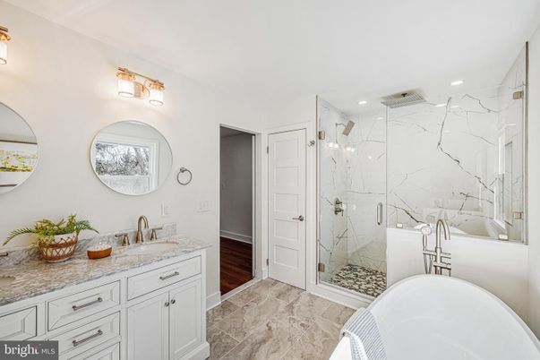 Bathroom, Dual Sink Vanities, Free Standing Baths, Glass Shower, Interior, Marble Walls, Recessed Lighting