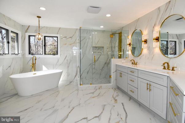 Bathroom, Dual Sink Vanities, Free Standing Baths, Glass Shower, Interior, Marble, Marble Walls, Pendant Lights, Recessed Lighting