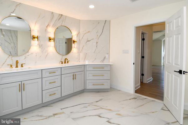 Bathroom, Dual Sink Vanities, Interior, Marble, Marble Walls, Recessed Lighting