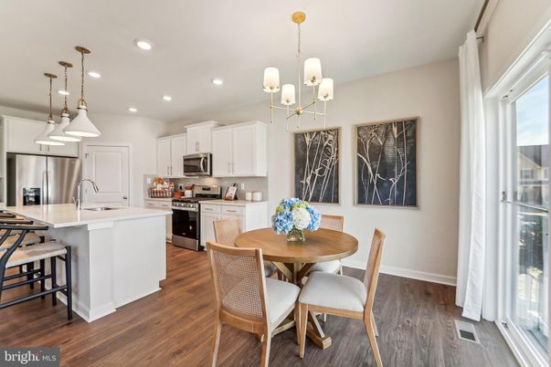 Chandelier, Dining room, Interior, Kitchen, Pendant Lights, Recessed Lighting, Stainless Steel Appliances, Wood Texture Flooring