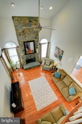 Fireplace, Interior, Living room, Pendant Lights, Recessed Lighting, Stone Walls, Wood Texture Flooring