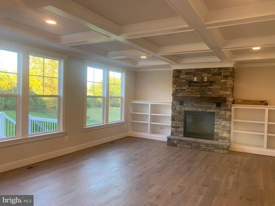 Empty room, Fireplace, Interior, Recessed Lighting, Stone Walls, Wood Texture Flooring