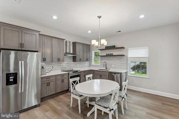 Chandelier, Dining room, Interior, Kitchen, Pendant Lights, Recessed Lighting, Stainless Steel Appliances, Wood Texture Flooring