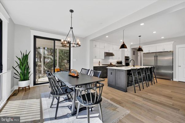 Dining room, Interior, Kitchen, Pendant Lights, Recessed Lighting, Stainless Steel Appliances, Wood Texture Flooring