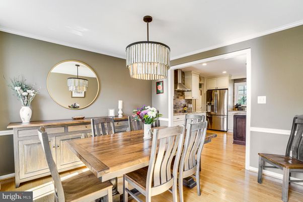 Chandelier, Dining room, Interior, Kitchen, Pendant Lights, Recessed Lighting, Stainless Steel Appliances, Wood Texture Flooring