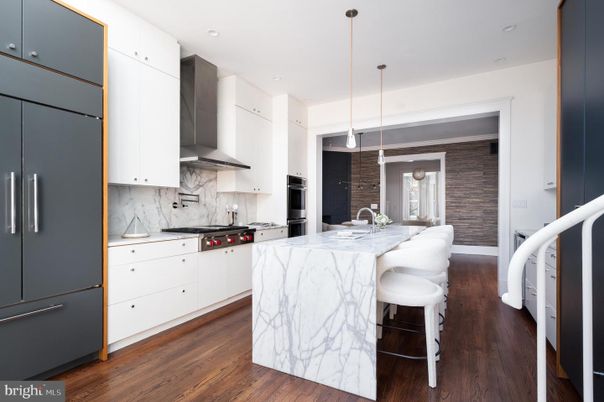 Interior, Kitchen, Marble Walls, Pendant Lights, Recessed Lighting, Stainless Steel Appliances, Wood Texture Flooring