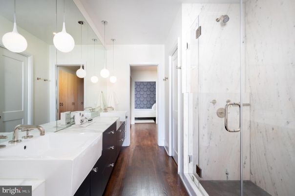 Bathroom, Dual Sink Vanities, Glass Shower, Interior, Pendant Lights, Wood Texture Flooring