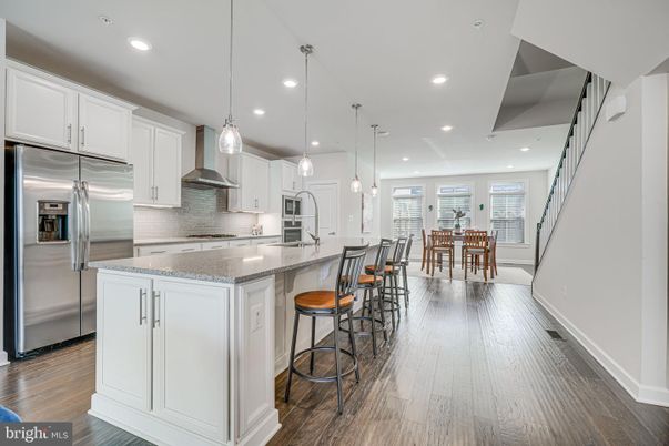 Dining room, Interior, Kitchen, Pendant Lights, Recessed Lighting, Stainless Steel Appliances, Wood Texture Flooring