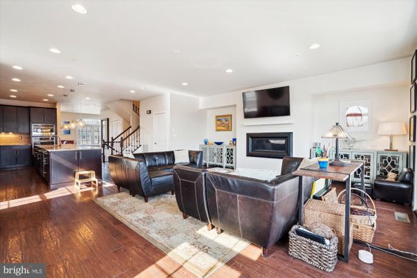Fireplace, Interior, Kitchen, Living room, Pendant Lights, Recessed Lighting, Stainless Steel Appliances, Wood Texture Flooring