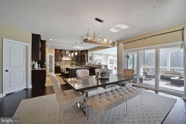 Chandelier, Dining room, Interior, Kitchen, Pendant Lights, Recessed Lighting, Stainless Steel Appliances, Wood Texture Flooring