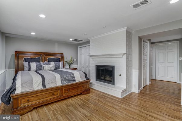 Bedroom, Fireplace, Interior, Recessed Lighting, Wood Texture Flooring