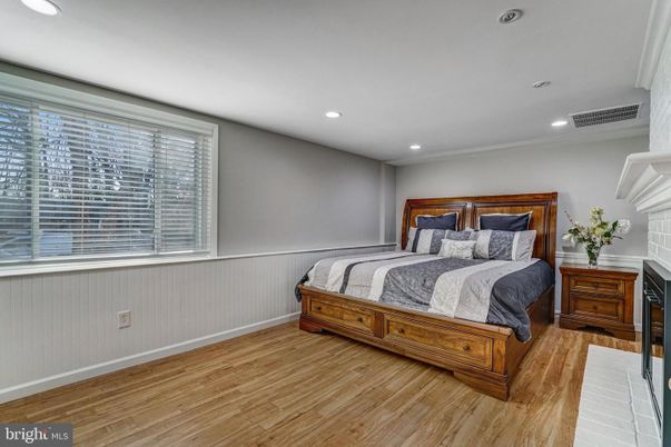 Bedroom, Fireplace, Interior, Recessed Lighting, Wood Texture Flooring