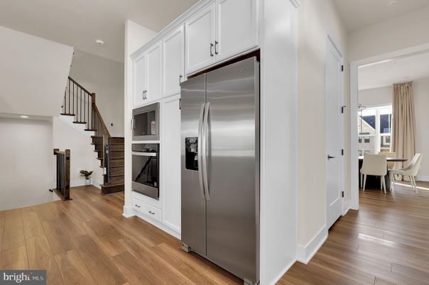 Dining room, Interior, Kitchen, Recessed Lighting, Stainless Steel Appliances, Wood Texture Flooring