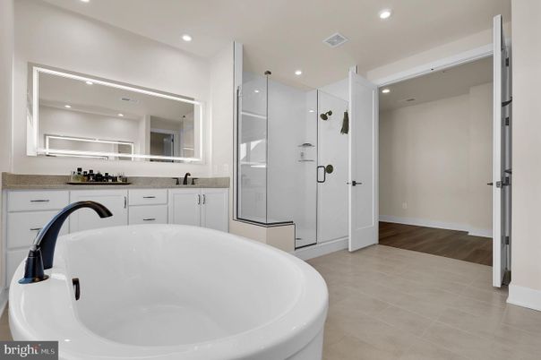 Bathroom, Dual Sink Vanities, Free Standing Baths, Glass Shower, Interior, Recessed Lighting, Wood Texture Flooring