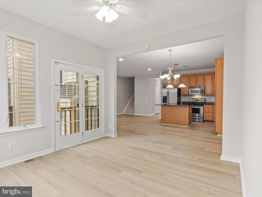 Chandelier, Empty room, Interior, Kitchen, Recessed Lighting, Stainless Steel Appliances, Wood Texture Flooring