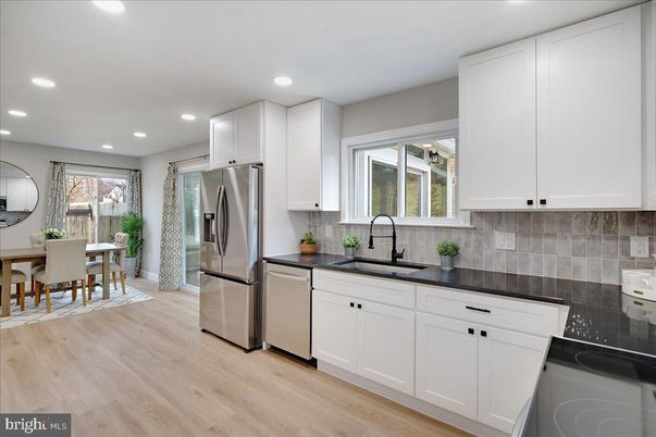Dining room, Interior, Kitchen, Recessed Lighting, Stainless Steel Appliances, Wood Texture Flooring