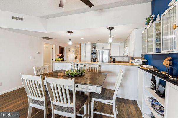 Dining room, Interior, Kitchen, Pendant Lights, Recessed Lighting, Stainless Steel Appliances, Wood Texture Flooring
