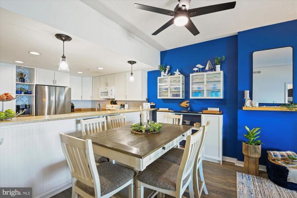 Dining room, Interior, Kitchen, Pendant Lights, Recessed Lighting, Stainless Steel Appliances, Wood Texture Flooring