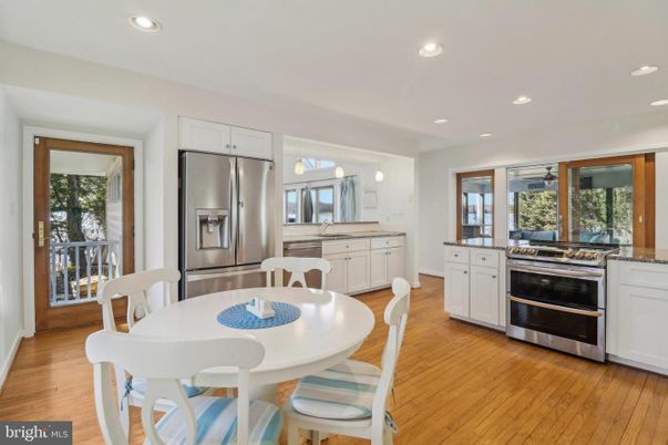 Dining room, Interior, Kitchen, Recessed Lighting, Stainless Steel Appliances, Wood Texture Flooring
