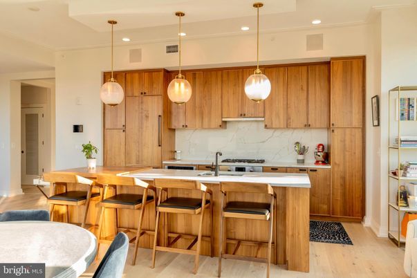 Interior, Kitchen, Marble Walls, Pendant Lights, Recessed Lighting, Stainless Steel Appliances, Wood Texture Flooring