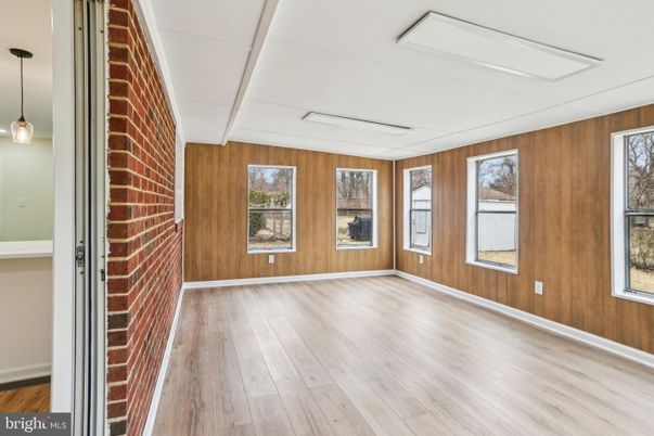 Empty room, Fireplace, Interior, Pendant Lights, Stone Walls, Wood Texture Flooring, Wooden Walls