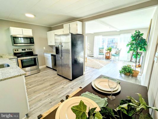 Dining room, Interior, Kitchen, Recessed Lighting, Stainless Steel Appliances, Wood Texture Flooring