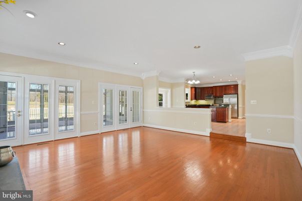 Chandelier, Empty room, Interior, Kitchen, Recessed Lighting, Stainless Steel Appliances, Wood Texture Flooring