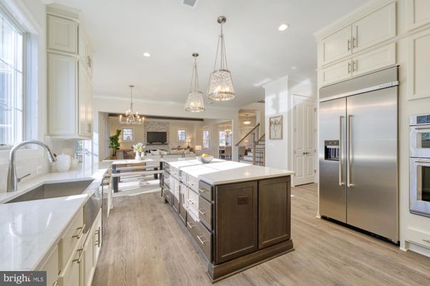 Chandelier, Interior, Kitchen, Living room, Pendant Lights, Recessed Lighting, Stainless Steel Appliances, Wood Texture Flooring