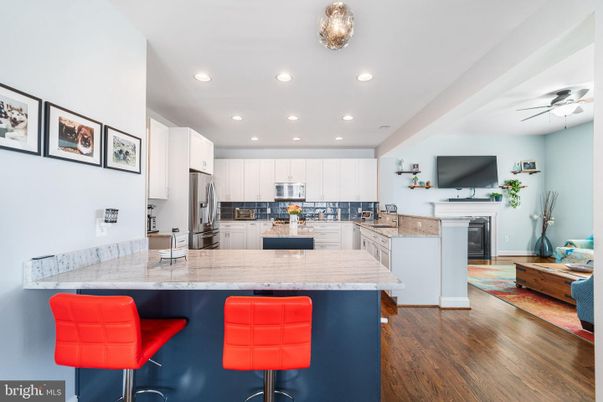 Fireplace, Interior, Kitchen, Recessed Lighting, Stainless Steel Appliances, Wood Texture Flooring