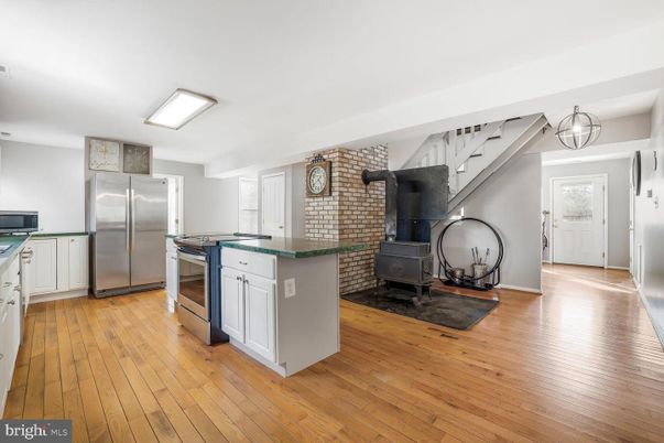 Interior, Kitchen, Stainless Steel Appliances, Stone Walls, Wood Texture Flooring