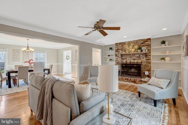 Chandelier, Dining room, Fireplace, Interior, Living room, Recessed Lighting, Stone Walls, Wood Texture Flooring