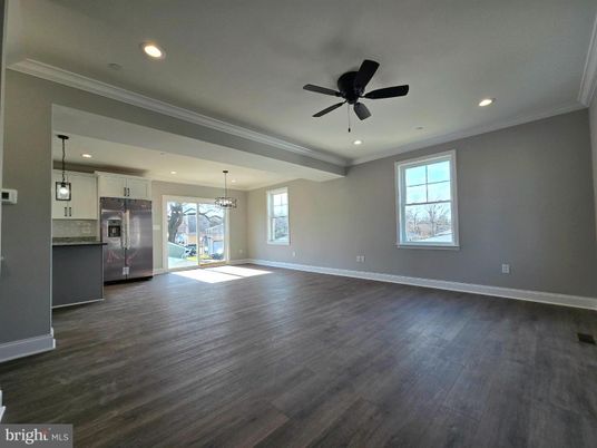 Empty room, Interior, Kitchen, Pendant Lights, Recessed Lighting, Stainless Steel Appliances, Wood Texture Flooring