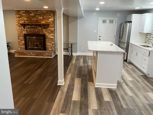 Fireplace, Interior, Kitchen, Recessed Lighting, Stone Walls, Wood Texture Flooring