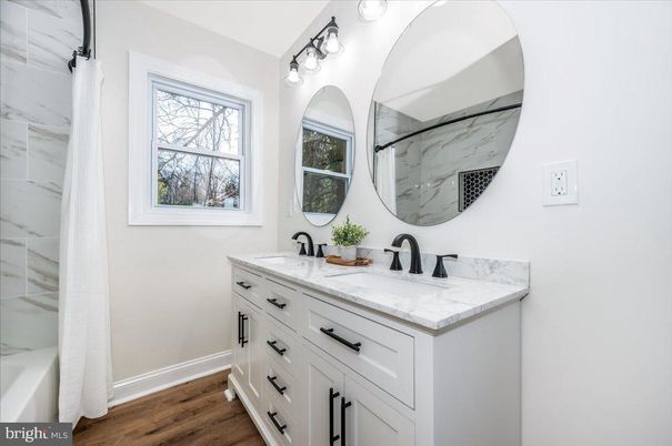 Bathroom, Dual Sink Vanities, Interior, Marble Walls, Wood Texture Flooring
