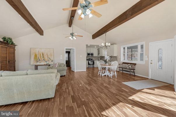 Chandelier, Dining room, Interior, Kitchen, Living room, Stainless Steel Appliances, Wooden Beams, Wood Texture Flooring