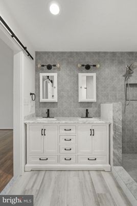 Bathroom, Dual Sink Vanities, Interior, Recessed Lighting, Wood Texture Flooring