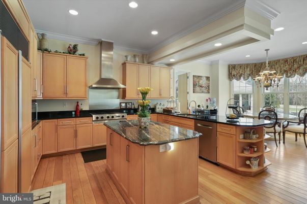 Chandelier, Dining room, Interior, Kitchen, Recessed Lighting, Stainless Steel Appliances, Wood Texture Flooring