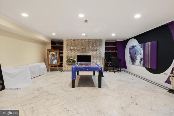 Fireplace, Game Room, Interior, Marble, Recessed Lighting, Stone Walls