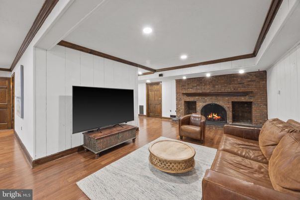 Fireplace, Interior, Living room, Recessed Lighting, Stone Walls, Wood Texture Flooring