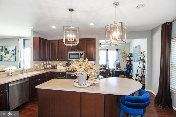 Chandelier, Interior, Kitchen, Pendant Lights, Recessed Lighting, Stainless Steel Appliances, Wood Texture Flooring