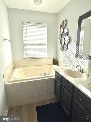 Bathroom, Dual Sink Vanities, Interior, Recessed Lighting, Wood Texture Flooring