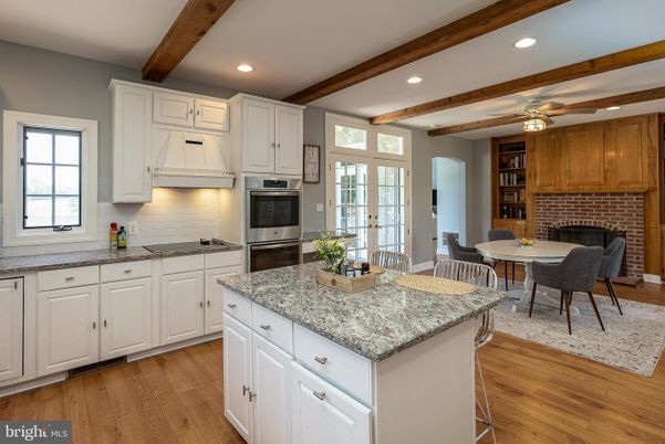 Dining room, Interior, Kitchen, Recessed Lighting, Stainless Steel Appliances, Stone Walls, Wooden Beams, Wood Texture Flooring